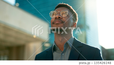Black man in business, thinking about future ideas and corporate employee outdoor, dream and inspiration. Insight, decision and brainstorming with goals, mind with travel or commute to work in city Black man in business, thinking about future ideas and corporate employee outdoor, dream and inspiration. Insight, decision and brainstorming with goals, mind with travel or commute to work in city 135426148