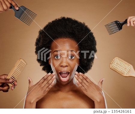 Portrait, wow and hands in a salon with a black woman in studio on a brown background for beauty or cosmetics. Face, afro and hair with a young female person looking surprised at natural care options Portrait, wow and hands in a salon with a black woman in studio on a brown background for beauty or cosmetics. Face, afro and hair with a young female person looking surprised at natural care options 135426161