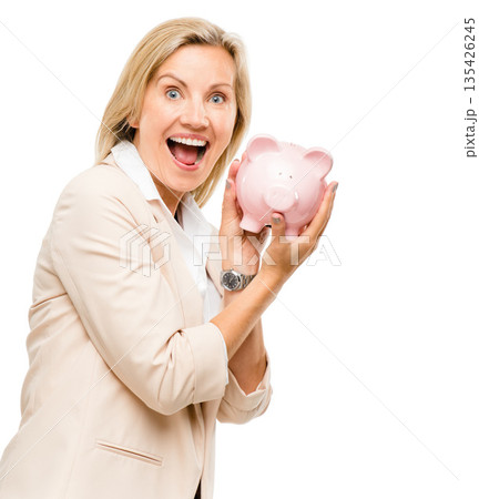 Happy woman, surprise and piggy bank for money savings or investment isolated on a white studio background. Portrait of female person with piggybank for coins, budget finance or cash on mockup space Happy woman, surprise and piggy bank for money savings or investment isolated on a white studio background. Portrait of female person with piggybank for coins, budget finance or cash on mockup space 135426245