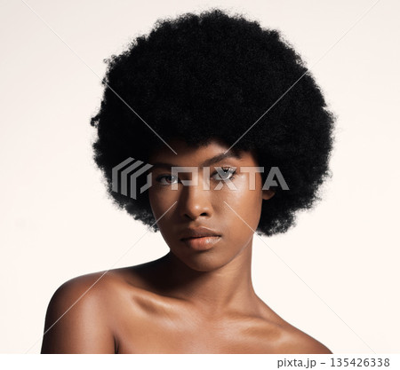 Natural beauty, skin care and portrait of black woman with afro, cosmetics and dermatology on white background. Skincare, studio and African model with serious face, salon makeup glow and wellness. Natural beauty, skin care and portrait of black woman with afro, cosmetics and dermatology on white background. Skincare, studio and African model with serious face, salon makeup glow and wellness. 135426338