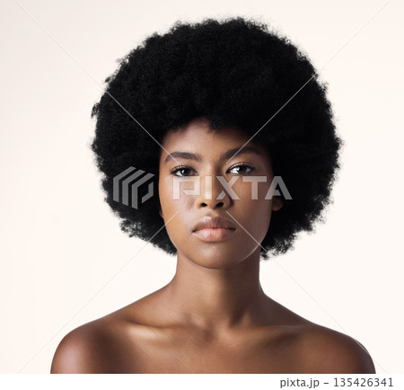 Beauty, skin care and portrait of black woman with afro, cosmetics and dermatology on white background. Natural skincare, studio and African model with serious face, salon makeup glow and wellness. 135426341