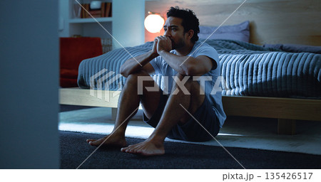 Night, anxiety and man with depression, mental health and insomnia from sad thoughts in bedroom. Late, contemplation and anxious person with grief, worry and sleepless from stress in apartment. 135426517