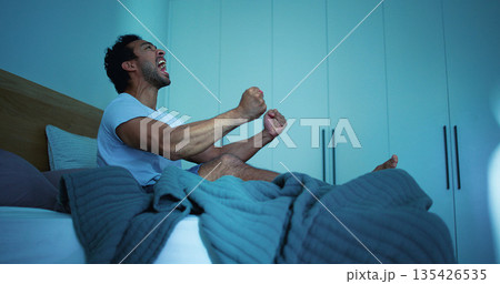 Insomnia, night and man in bedroom with scream for burnout, exhausted and fatigue for mental health. Tired, dark and person with upset, angry and shout for sleepless, bad dream and frustrated in home 135426535