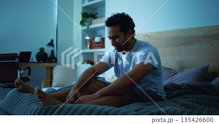 Night, stress and sad man with depression, mental health and sleepless from lonely memories in bed. Late, contemplation and upset person with anxiety, grief and insomnia with thinking in apartment. 135426600