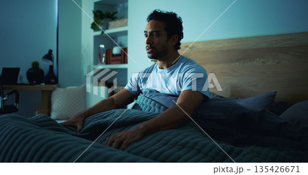 Insomnia, scared and man in bedroom at night for burnout, exhausted and fatigue for mental health. Tired, dark and person with fear, awake and afraid for sleepless, bad dream and nightmare in home Insomnia, scared and man in bedroom at night for burnout, exhausted and fatigue for mental health. Tired, dark and person with fear, awake and afraid for sleepless, bad dream and nightmare in home 135426671