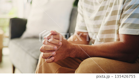 Hands, trauma and man on sofa in home with stress, phobia or stimming for panic attack with mental health. Overthink, crisis and male person in living room with anxiety, fear or trigger in house. Hands, trauma and man on sofa in home with stress, phobia or stimming for panic attack with mental health. Overthink, crisis and male person in living room with anxiety, fear or trigger in house. 135426755