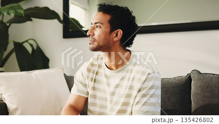 Man, thinking and relax on sofa in home with reflection, memory and smile with nostalgia in living room. Happy person, perspective and decision on couch, mindset or daydream in lounge at apartment 135426802