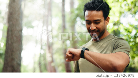 Happy, athlete and man with smart watch, park and exercise progress on app, wellness and heart rate. Outdoor, runner and person with tech for workout updates, space and health monitoring or fitness 135426979