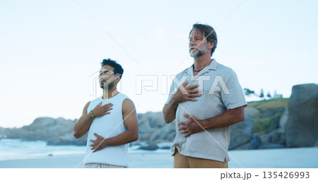 Outdoor, men and meditation for inner peace, beach and routine for mental health, breathing and calm. People, inhale and spiritual awareness in nature, stress relief and space on break or healing 135426993