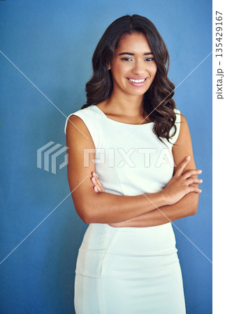 Happy, arms crossed and portrait of business woman in studio for professional, entrepreneur and mission. Pride, mockup and empowerment with female employee on wall background for creative and career Happy, arms crossed and portrait of business woman in studio for professional, entrepreneur and mission. Pride, mockup and empowerment with female employee on wall background for creative and career 135429167