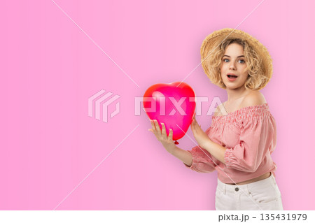 Valentine's Day features a woman holding a heart-shaped balloon 135431979