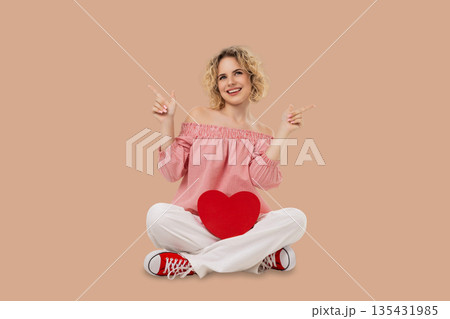 Valentine's Day: a model smiles with a heart Valentine's Day: a model smiles with a heart 135431985