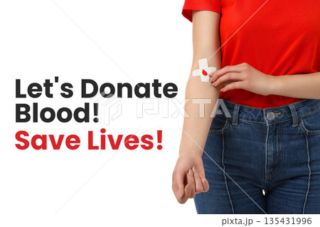 Person in red shirt with bandage on arm promoting blood donation Person in red shirt with bandage on arm promoting blood donation 135431996