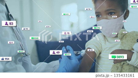 Vaccinating nurse injecting child at clinic, with syringe, teddy bear and media icons, copy space 135433161
