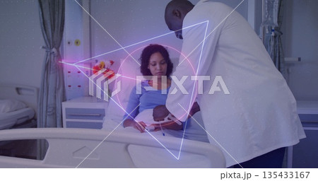 Examining doctor in lab coat checking pregnant abdomen in patient room, with hologram overlay 135433167