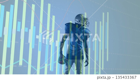Standing helmeted player in jersey holding football in analytics hub, with bar and line graphs 135433367