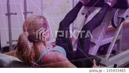 Pushing woman in turquoise sportswear doing leg press in gym, with machine and graph overlay Pushing woman in turquoise sportswear doing leg press in gym, with machine and graph overlay 135433465