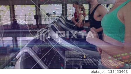 Running gym-goer wearing green sports bra and leggings using treadmill in cardio area, data overlay Running gym-goer wearing green sports bra and leggings using treadmill in cardio area, data overlay 135433468