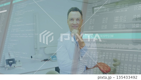 Leaning doctor wearing white coat studying data overlays with instruments, red apple in clinic 135433492