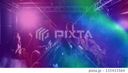 Crowd-surfing male fan riding over cheering crowd inside club, with stage lights and metal truss Crowd-surfing male fan riding over cheering crowd inside club, with stage lights and metal truss 135433564