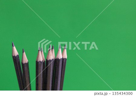 Black Pencils On Green Background 135434300