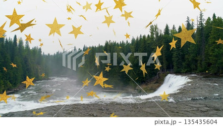 Flowing river tumbling over waterfall in evergreen forest with golden star overlay, copy space 135435604
