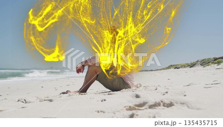 Sitting senior male wearing pink shirt on beach, with yellow energy effect, wristwatch, copy space Sitting senior male wearing pink shirt on beach, with yellow energy effect, wristwatch, copy space 135435715