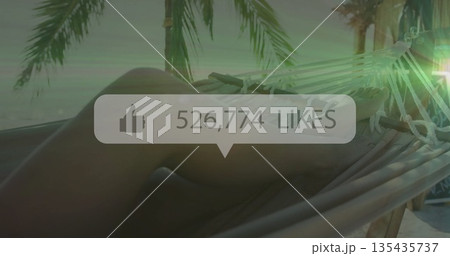 Reclining female wearing bikini relaxing on hammock at beach shore, overlay showing 526,774 likes 135435737