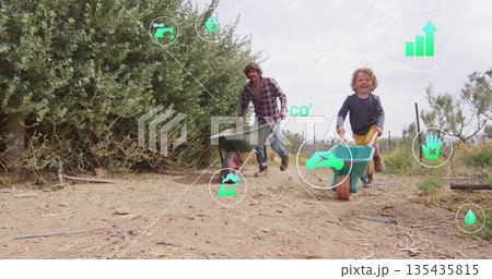 Racing man and boy pushing wheelbarrows on farm path, with irrigation tubing, eco icons 135435815