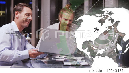 Reviewing man in business shirt holding printed report in meeting room, with laptop, charts, pens Reviewing man in business shirt holding printed report in meeting room, with laptop, charts, pens 135435834