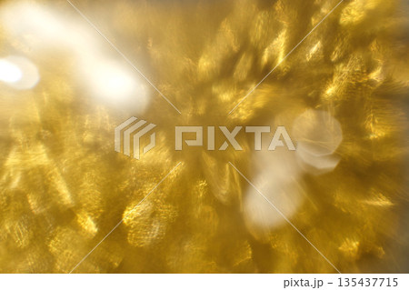 Golden bokeh background with shimmering light effects and abstract blurred 135437715