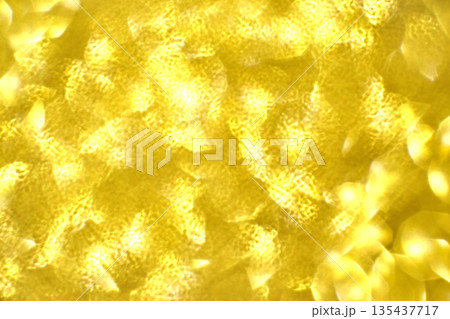Abstract gold light pattern with shimmering textures and soft yellow glow Abstract gold light pattern with shimmering textures and soft yellow glow 135437717