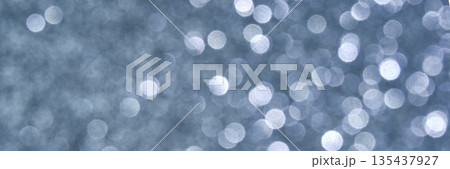 Abstract light bokeh background with blurred circular reflections in gray Abstract light bokeh background with blurred circular reflections in gray 135437927