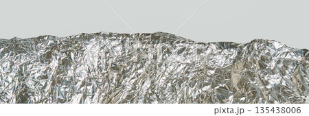 Crumpled silver aluminum foil texture with light reflection on smooth 135438006