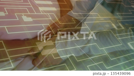 Palpating doctor's hands pressing patient's abdomen in examination room, with digital grid overlay Palpating doctor's hands pressing patient's abdomen in examination room, with digital grid overlay 135439096