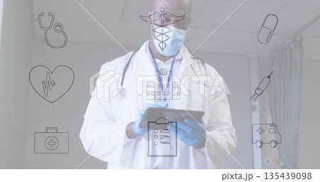 Holding digital tablet, senior doctor wearing stethoscope and mask reviewing patient info in clinic Holding digital tablet, senior doctor wearing stethoscope and mask reviewing patient info in clinic 135439098