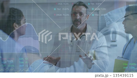 Doctor in white coat pointing at digital overlay in hospital room, with stethoscope and patient bed Doctor in white coat pointing at digital overlay in hospital room, with stethoscope and patient bed 135439115