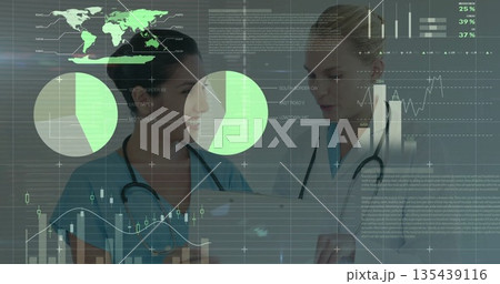 Reviewing data graphics by two medical staff in hospital corridor, with tablet, stethoscopes Reviewing data graphics by two medical staff in hospital corridor, with tablet, stethoscopes 135439116