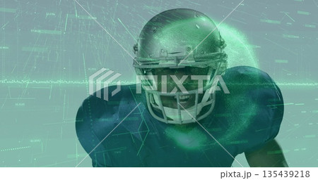 Shouting football player wearing silver helmet facemask navy pads amid virtual reality data overlay 135439218