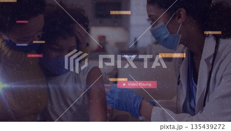 Nurse wearing lab coat administering vaccination with syringe and gloves in exam room, copy space Nurse wearing lab coat administering vaccination with syringe and gloves in exam room, copy space 135439272