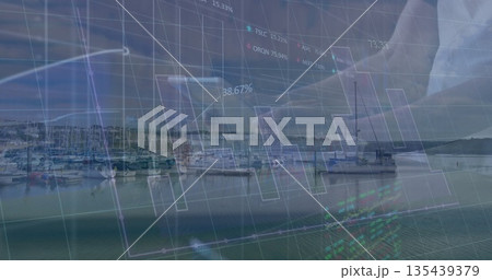 Docking sailboats lining wooden piers at coastal marina, with calm water and financial graphs 135439379