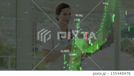 Nurse in scrubs with stethoscope reviewing tablet in hospital corridor, with financial charts Nurse in scrubs with stethoscope reviewing tablet in hospital corridor, with financial charts 135440476