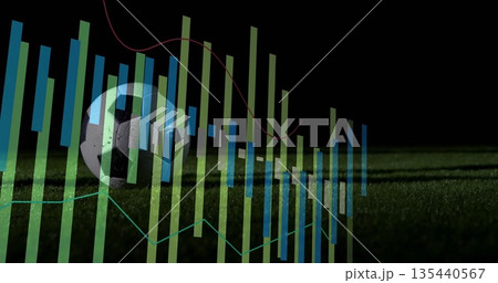 Resting soccer ball on grass turf at night, with data-chart overlays, copy space 135440567