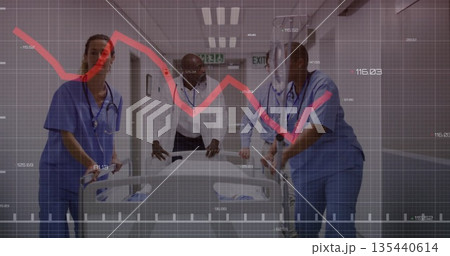 Medical team pushing empty gurney in hospital corridor, in scrubs with stethoscopes and exit signs Medical team pushing empty gurney in hospital corridor, in scrubs with stethoscopes and exit signs 135440614