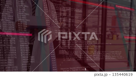 Viewing suited professional analyzing reflected code on glass wall in office with blinds binders Viewing suited professional analyzing reflected code on glass wall in office with blinds binders 135440619