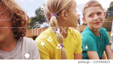 Sitting children gazing at floating digital environmental icons in leafy park on wooden bench Sitting children gazing at floating digital environmental icons in leafy park on wooden bench 135440825