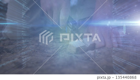 Cutting hands wearing shirt slicing block on gravel, with utility knife, blue code light 135440868