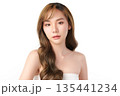 A beautiful young Asian woman with clean, fresh skin against a white background. Skincare, facial treatment, cosmetology, beauty, and spa. An elegant portrait of an Asian woman. 135441234