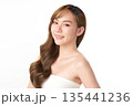 A beautiful young Asian woman with clean, fresh skin against a white background. Skincare, facial treatment, cosmetology, beauty, and spa. An elegant portrait of an Asian woman. 135441236