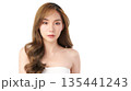 A beautiful young Asian woman with clean, fresh skin against a white background. Skincare, facial treatment, cosmetology, beauty, and spa. An elegant portrait of an Asian woman. 135441243